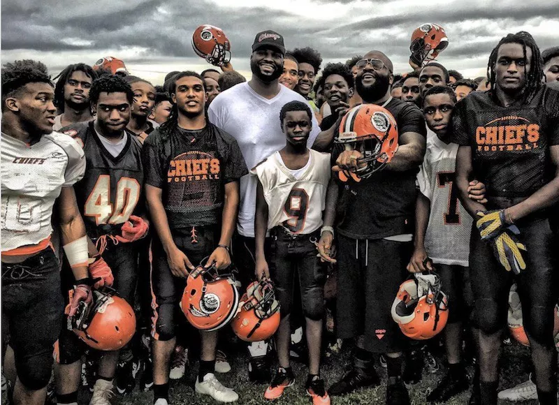 Rick Ross and the Miami Carol City football team