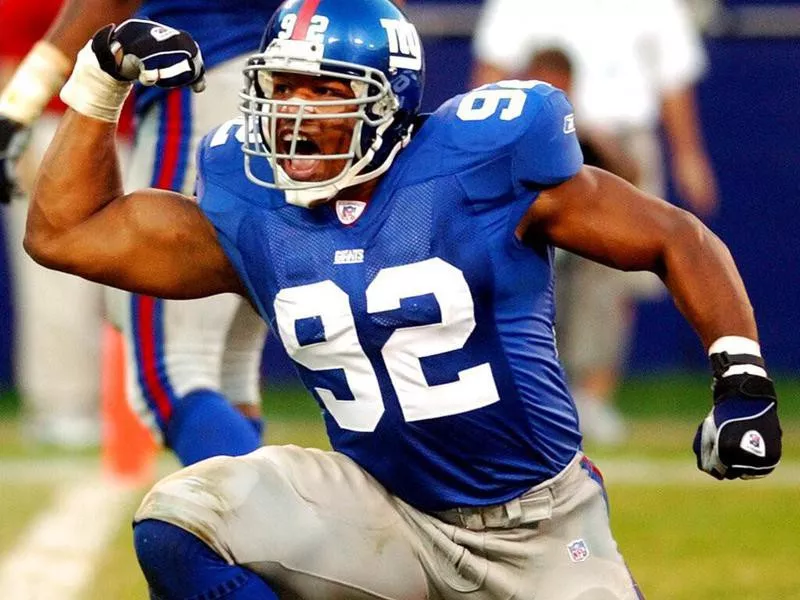 Michael Strahan celebrating on a big play