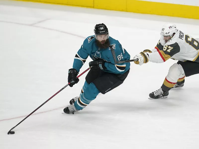 Brent Burns skates with puck