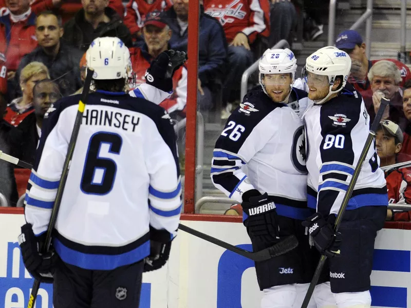 Winnipeg Jets right wing Blake Wheeler celebrates with Nik Antropov