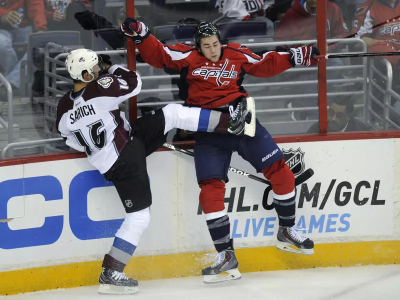 Cory Sarich and Tom Wilson collide