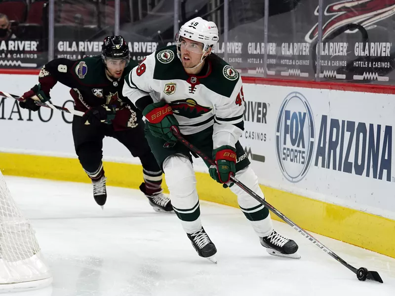 Minnesota Wild center Victor Rask skates away from Arizona Coyotes center Nick Schmaltz