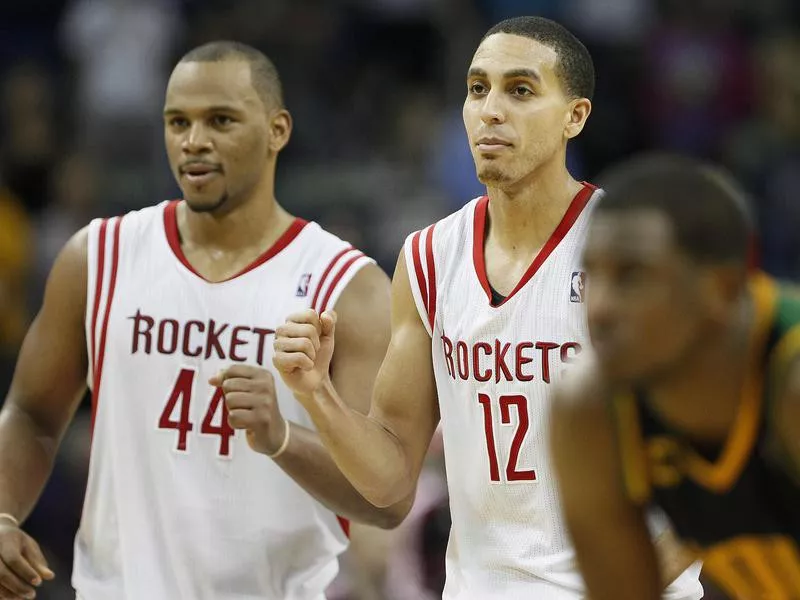 Chuck Hayes reacts with Kevin Martin