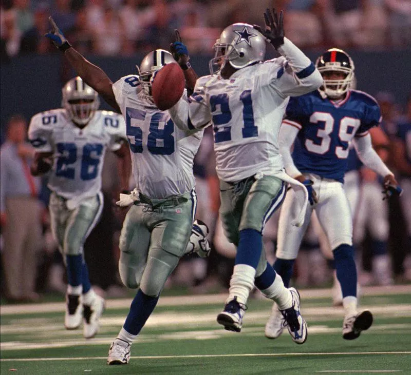 Deion Sanders heads for a touchdown