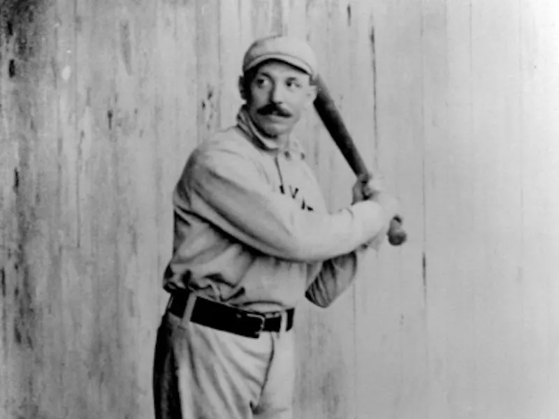 George Davis holding bat