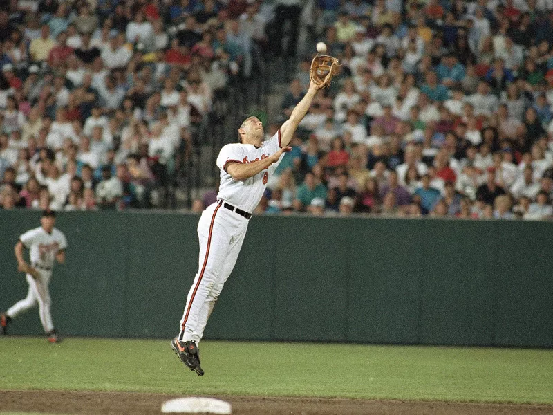 Baltimore Orioles shortstop Carl Ripken Jr. leaps to make a play