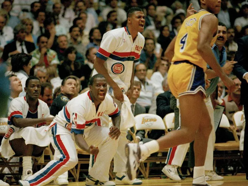 Detroit Pistons' Joe Dumars, Walker D. Russell, and Ralph Lewis jubilate