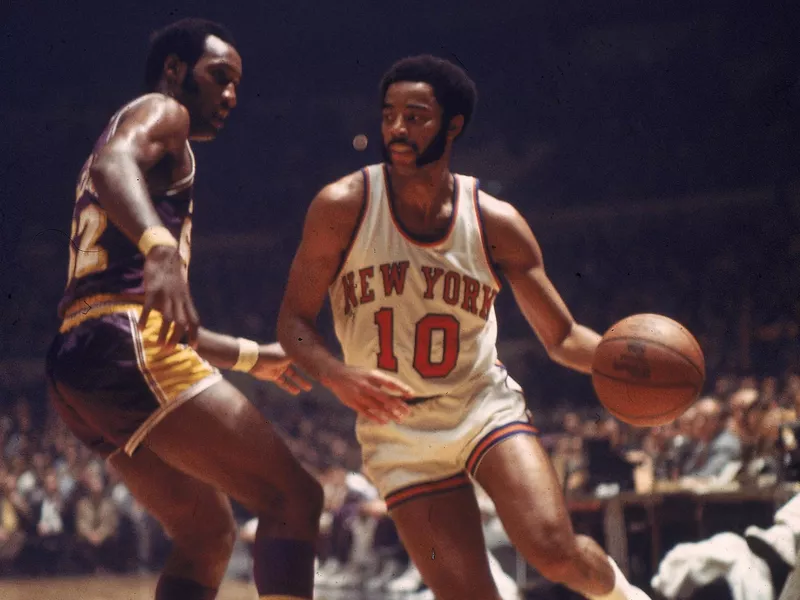 New York Knicks guard Walt Frazier handles the ball