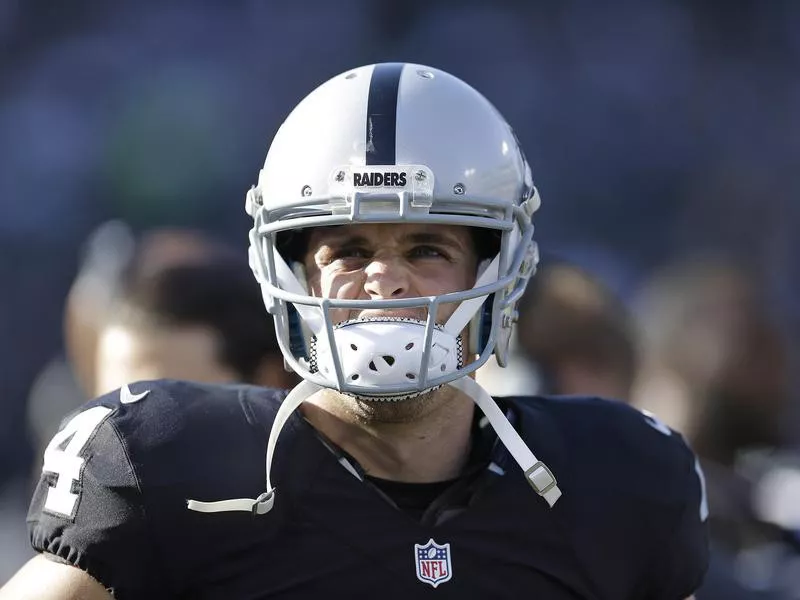 Oakland Raiders quarterback Derek Carr looks out