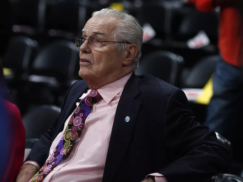 Retired Denver Nuggets head coach Doug Moe waits