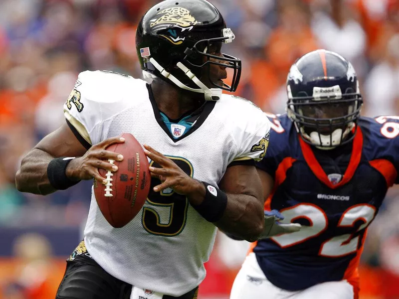 David Garrard; Elvis Dumervil