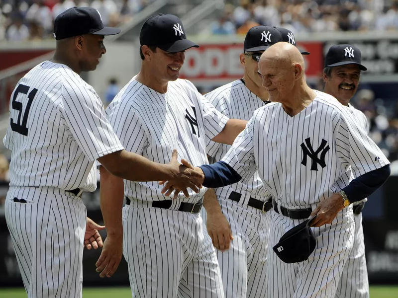 Bernie Williams shakes hands with BIll 