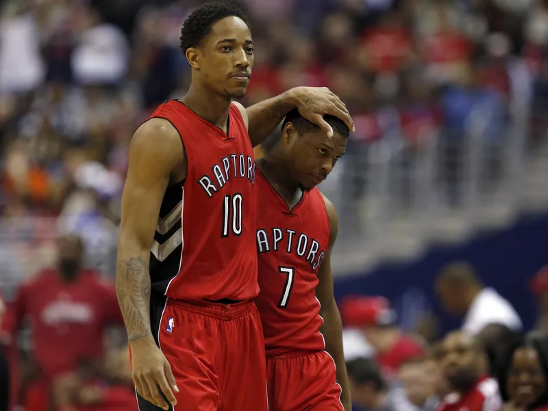 DeMar DeRozan and Kyle Lowry walk to bench