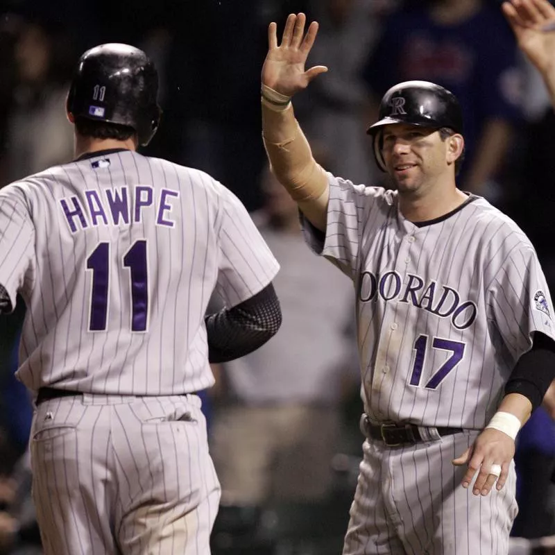 Colorado Rockies' Todd Helton and Brad Hawpe celebrate