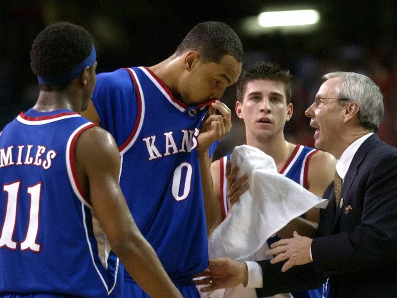 Roy williams with kansas players