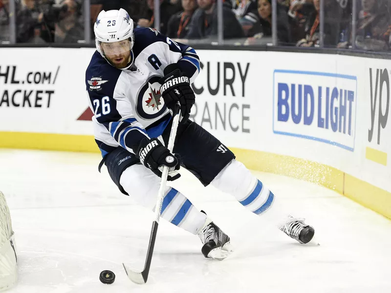 Blake Wheeler moves puck