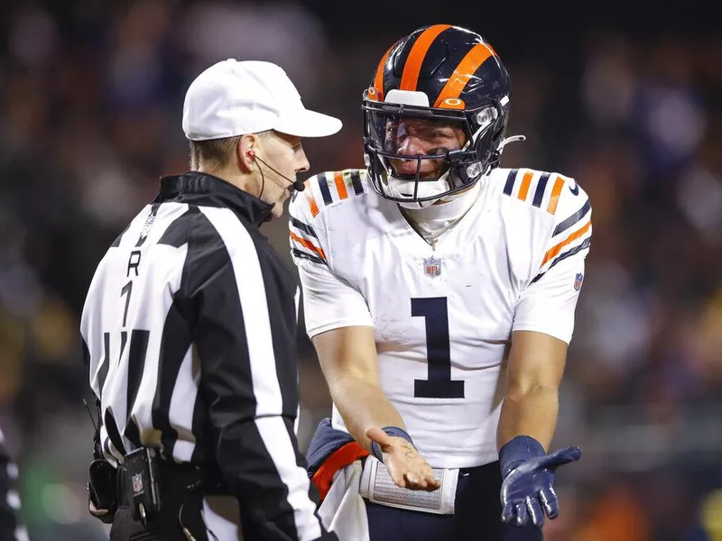 Chicago Bears quarterback Justin Fields arguing with referee