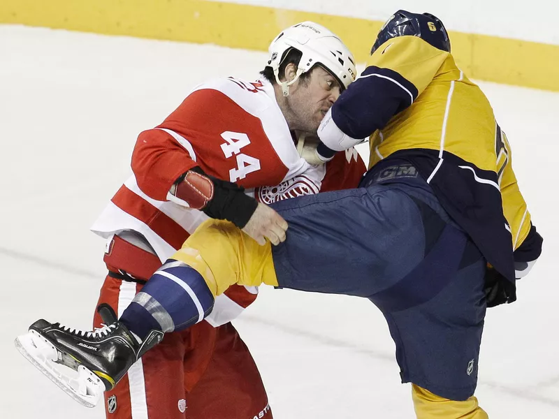 Detroit Red Wings right wing Todd Bertuzzi fights with Nashville Predators defenseman Shea Weber