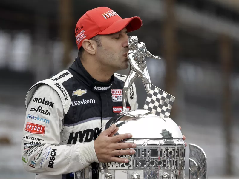 Tony Kanaan kisses the Borg-Warner Trophy