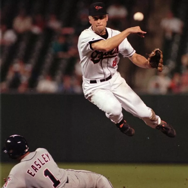 Cal Ripken Jr. turns a double play against California Angels