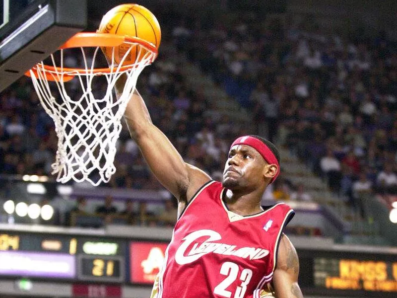 LeBorn James scores a basket on Oct. 29, 2003