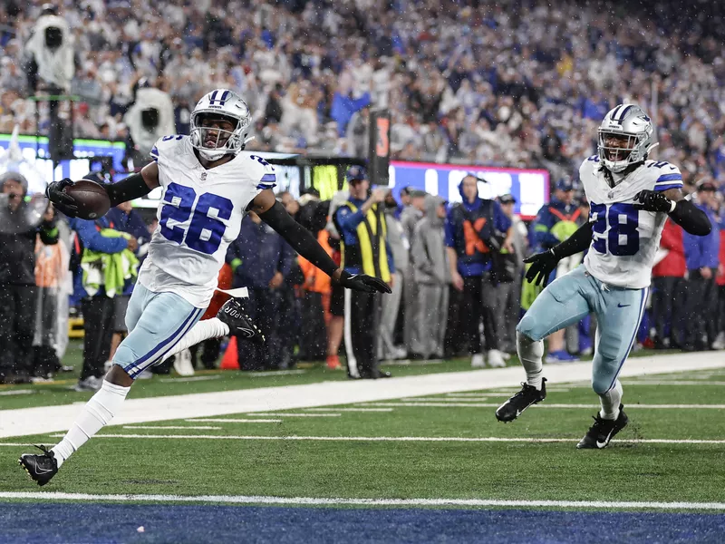 Dallas Cowboys cornerback DaRon Bland scores after intercepting a pass