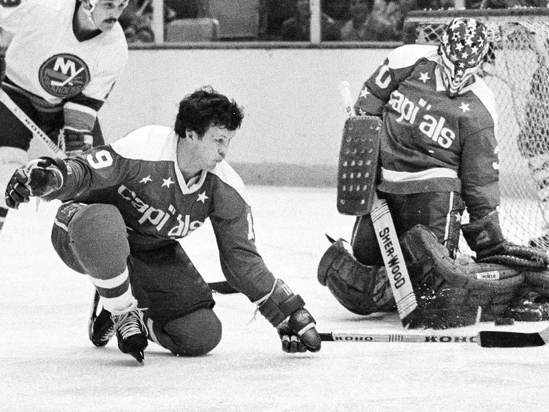 Washington Capitals' Bryan Watson helps to defend as goalie Bernie Wolfe makes save