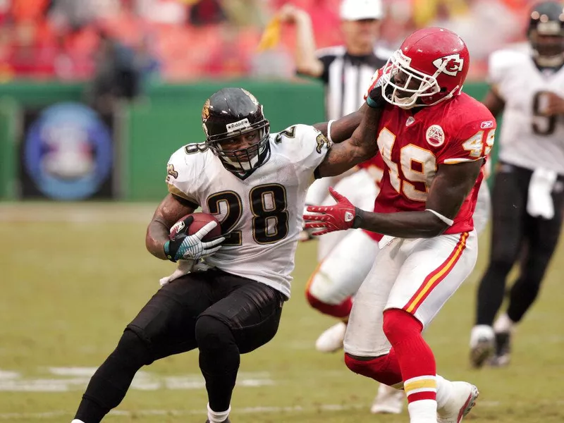 Kansas City Chiefs defensive back Bernard Pollard battles Jacksonville Jaguars running back Fred Taylor