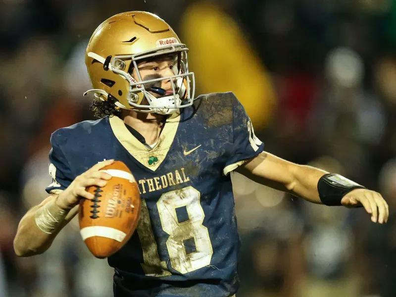 Cathedral High quarterback Danny O'Neil drops back to pass