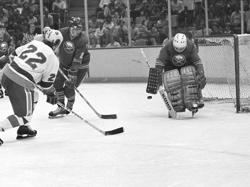 Mike Bossy watches his shot pass Philadelphia Flyer goalie Pete Peeters