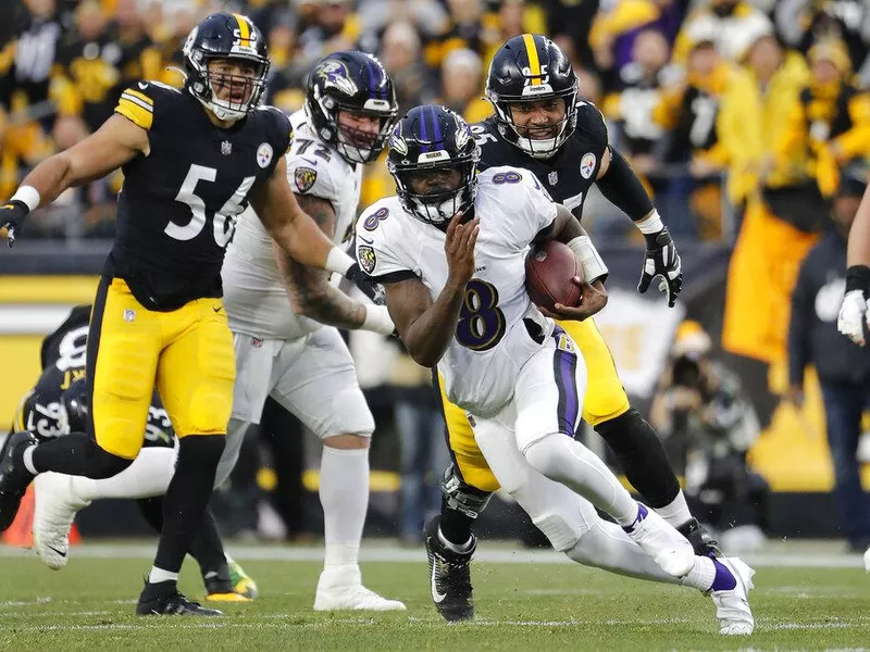 Baltimore Ravens quarterback Lamar Jackson running