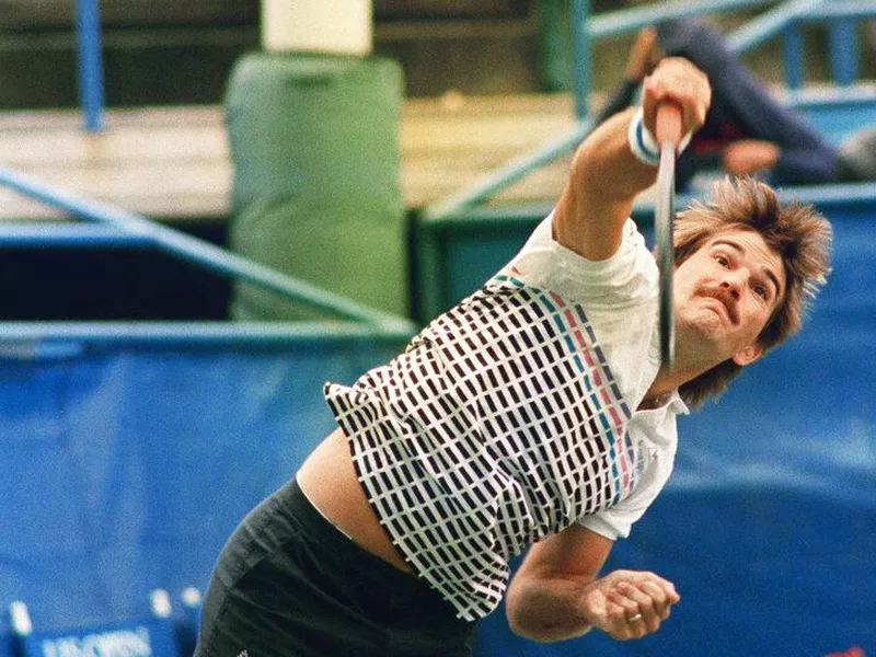 Johan Kriek of Naples, Fla., serves against John Sadri of Charlotte, N.C.,