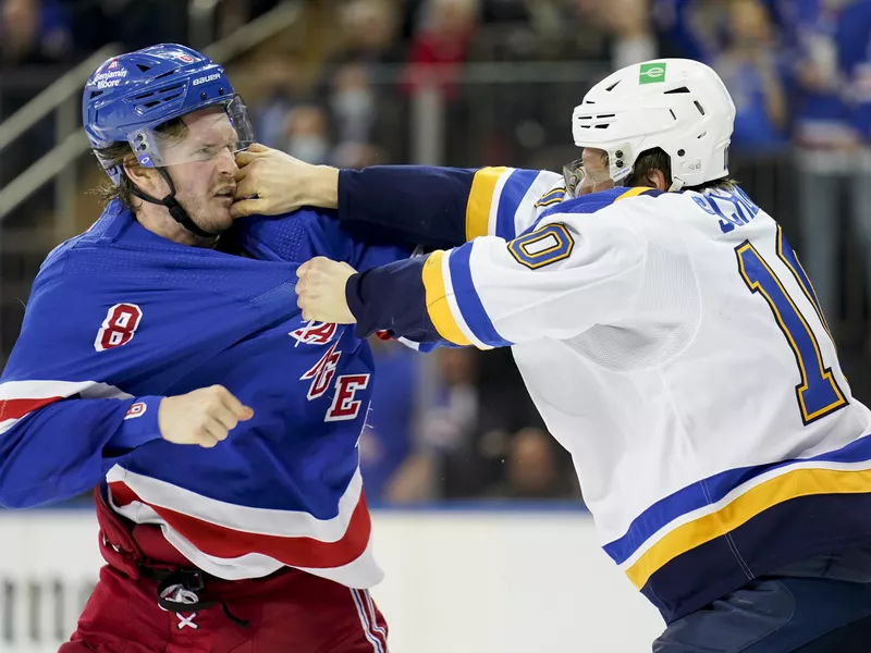 New York Rangers defenseman Jacob Trouba and St. Louis Blues center Brayden Schenn fight