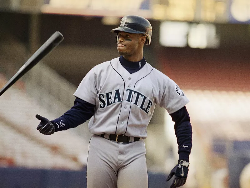 Ken Griffey Jr. flips bat