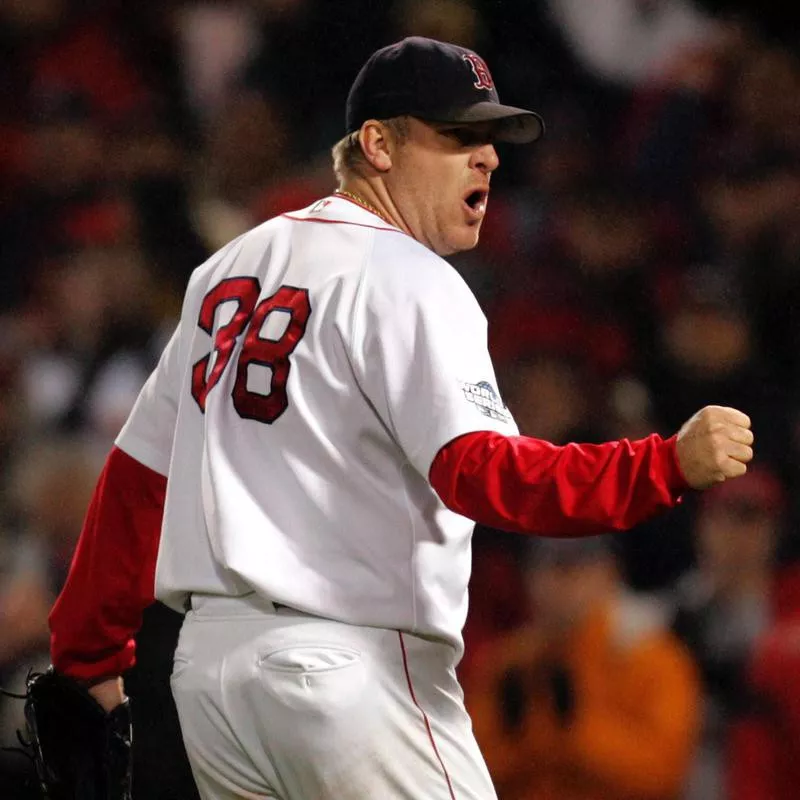 Boston Red Sox pitcher Curt Schilling pumps fist