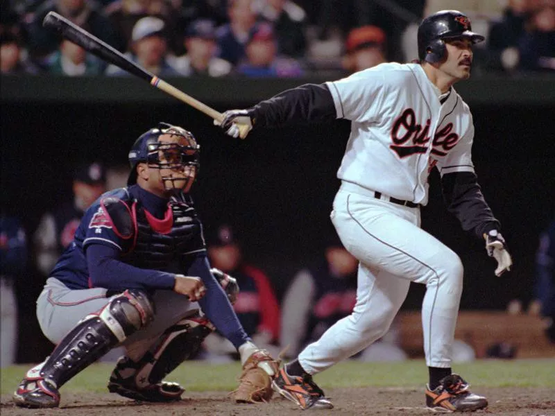 Rafael Palmeiro hits the ball