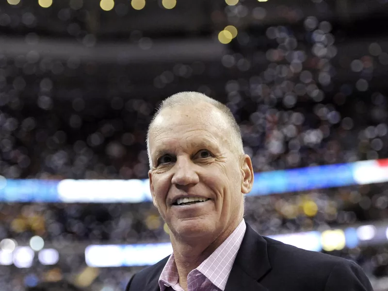 Doug Collins walks off the court