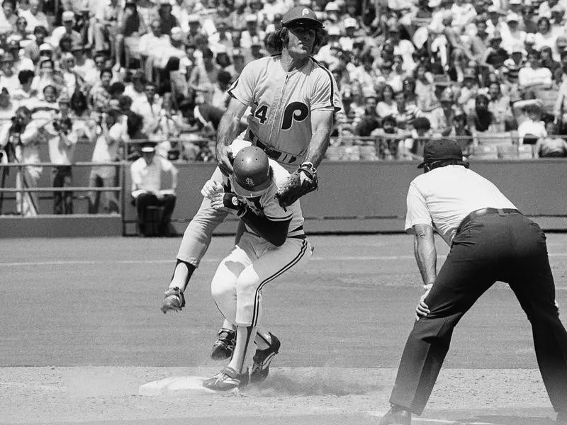 Pete Rose lands on back of Garry Templeton