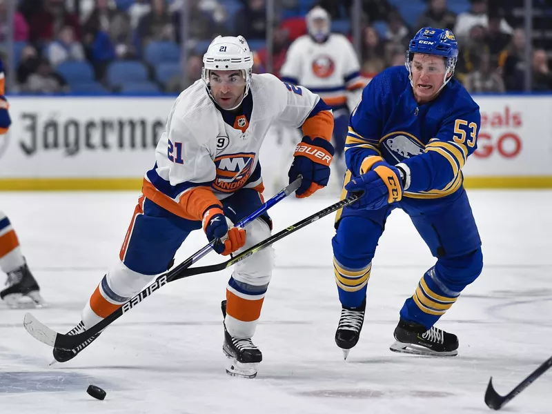 Kyle Palmieri and Jeff Skinner chase the puck