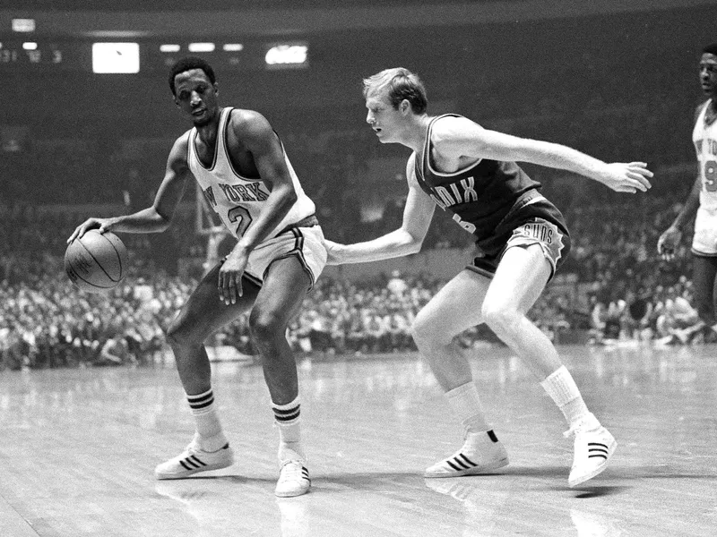 Dick Barnett dribbles against Dick van Arsdale