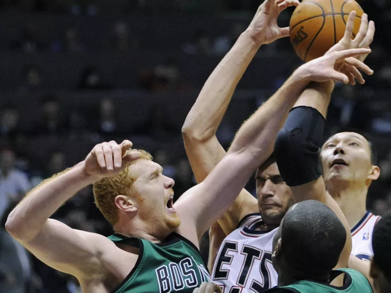 Brian Scalabrine slaps ball from New Jersey Net Brook Lopez