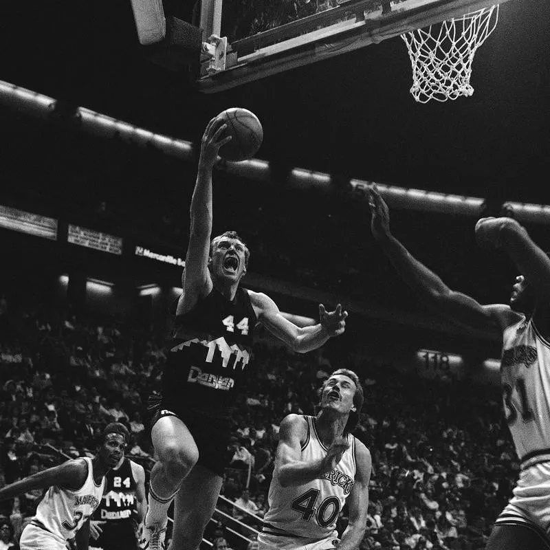 Dan Issel goes up for basket