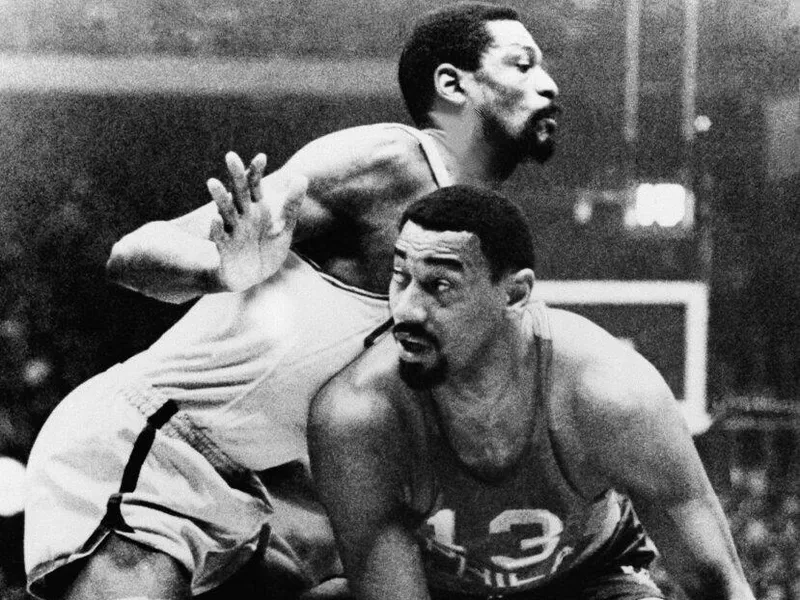 Wilt Chamberlain plays against Bill Russell