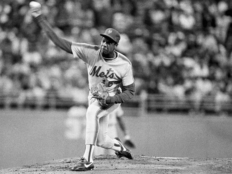 New York Mets pitcher Dwight Gooden hurls one toward plate