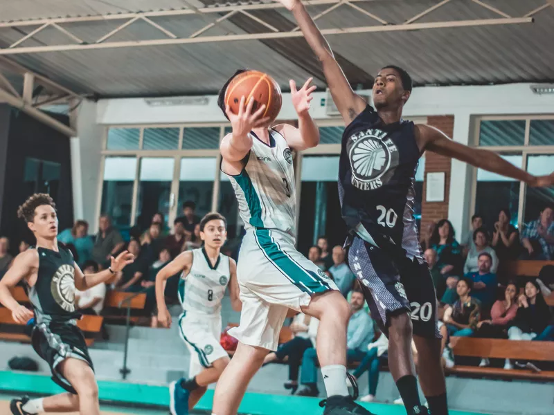 Youth basketball players competing in a game