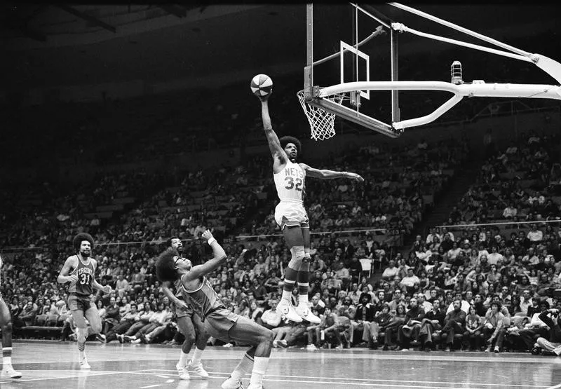 New York Nets' Julius Erving scores