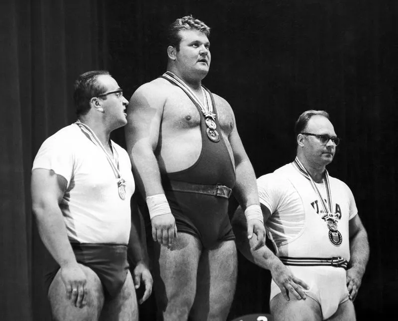 Yury Vlasov with others on podium