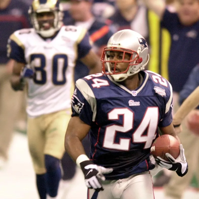 New England Patriots cornerback Ty Law running