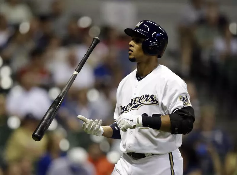 Carlos Gomez flips his bat