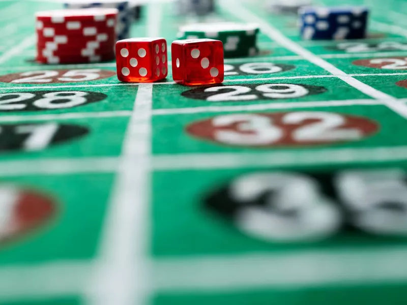 Gambling chips and dice on a roulette table